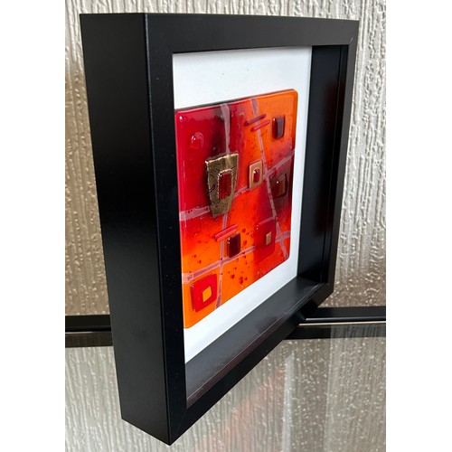 413 - Lisa Villarospo. Two glass wall art in oranges, reds and gold in deep square black frames. 45 x 45cm... 