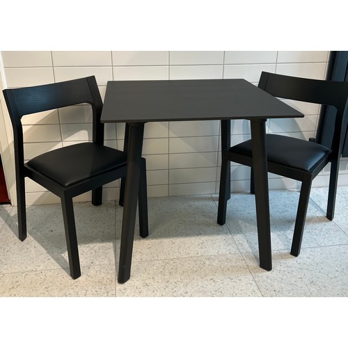 107 - A Muuto square black contemporary wooden table 75 x 75cm x 74cm h together with two black Case chair... 