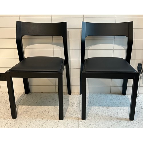 107 - A Muuto square black contemporary wooden table 75 x 75cm x 74cm h together with two black Case chair... 