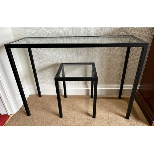 109 - Two black metal and glass tables. Hall table 100 w x 35 d x 72cm h. Coffee table 35 w x 35 d x 45cm ... 