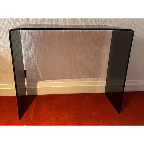 112 - A black glass contemporary hall table. 90 w x 36 d x 75cm h.