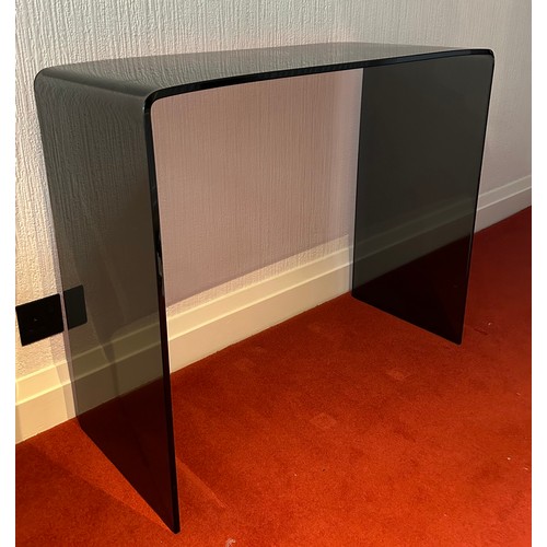 112 - A black glass contemporary hall table. 90 w x 36 d x 75cm h.