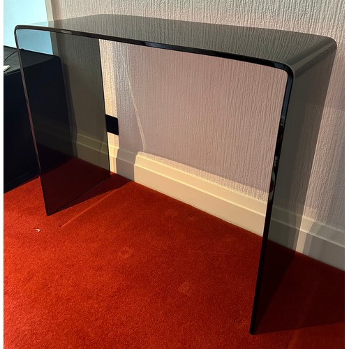 112 - A black glass contemporary hall table. 90 w x 36 d x 75cm h.