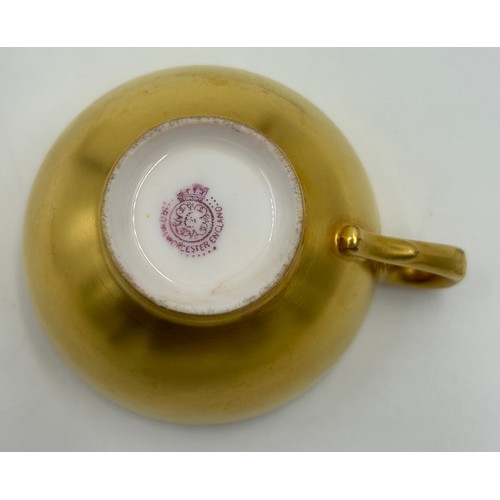 295 - A Royal Worcester miniature cup & saucer decorated with fruit on a moss background and gilt edging, ... 