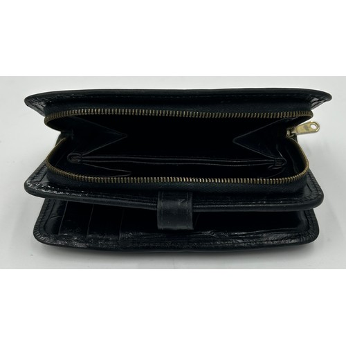 902 - A Mulberry Leather Wallet in black reptile print with zipped coin purse and three note compartments,... 