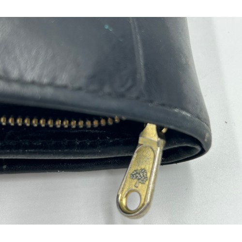 902 - A Mulberry Leather Wallet in black reptile print with zipped coin purse and three note compartments,... 