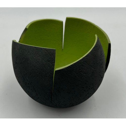 281 - A contemporary Ashraf Hanna textured earthenware vessel with charcoal exterior and lime green interi... 