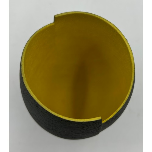 284 - A contemporary Ashraf Hanna textured earthenware vessel with charcoal exterior and yellow interior 1... 