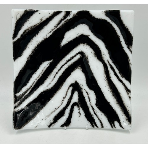 412 - A Melt Design black and white glass shallow dish approx. 30cm square with label together with a cont... 