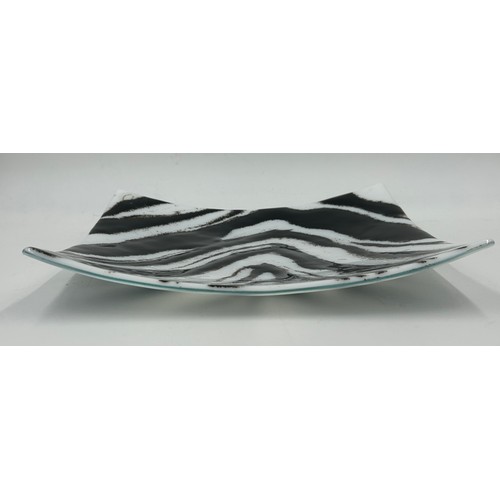 412 - A Melt Design black and white glass shallow dish approx. 30cm square with label together with a cont... 