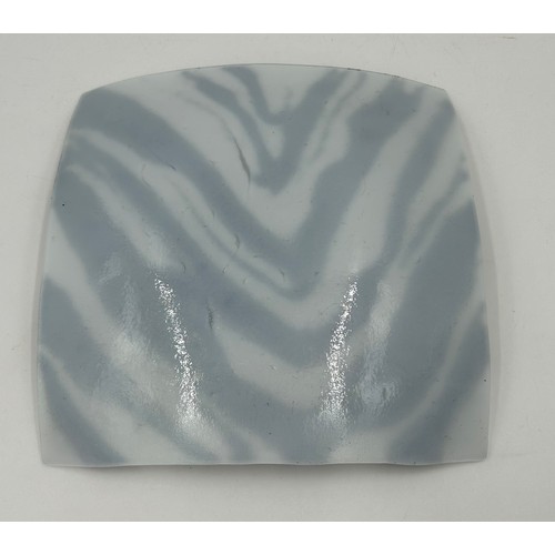 412 - A Melt Design black and white glass shallow dish approx. 30cm square with label together with a cont... 