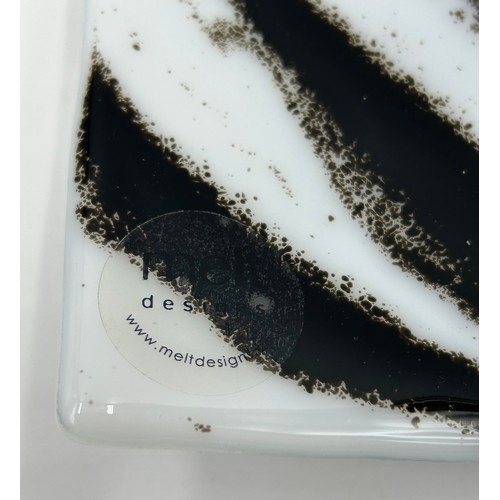 412 - A Melt Design black and white glass shallow dish approx. 30cm square with label together with a cont... 