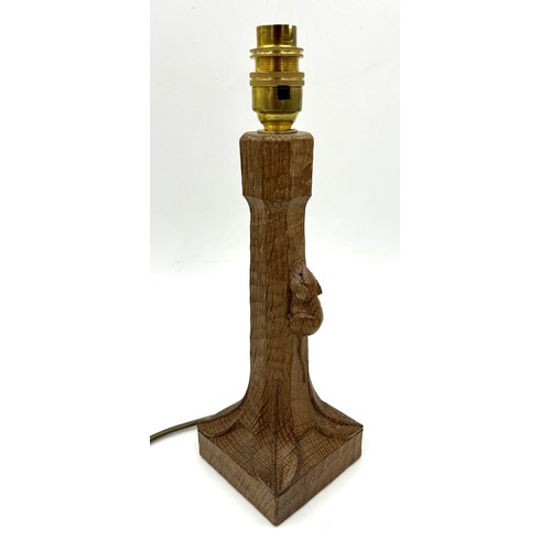 142 - Robert 'Mouseman' Thompson. An English oak table lamp with an octagonal column on a square base with... 