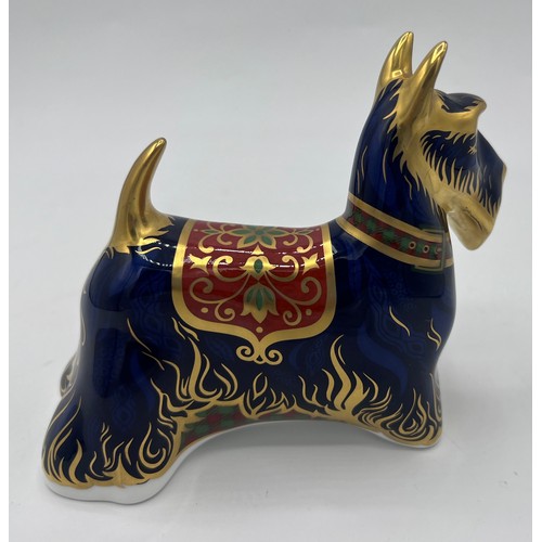 382 - A Royal Crown Derby Scottish Terrier paperweight. 11.5cm h. Gold stopper.