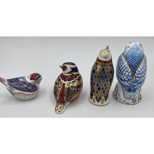 384 - Three Royal Crown Derby bird paperweights and a Royal Doulton bird candlesnuffer. Tallest 11.5cm. Tw... 