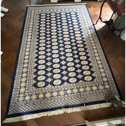 1222 - A large blue ground wool rug. 278 x 191cm.