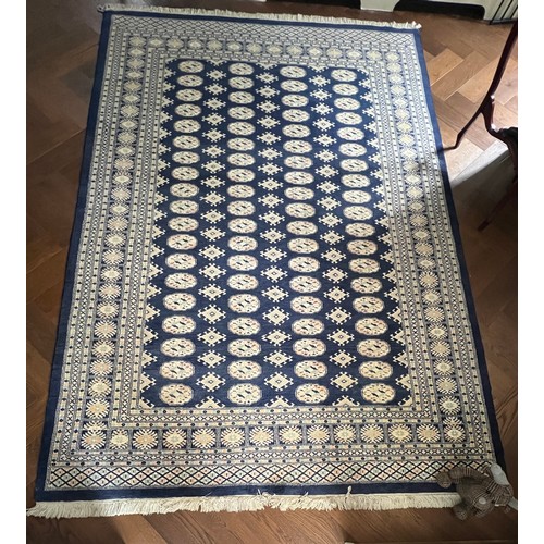 1222 - A large blue ground wool rug. 278 x 191cm.