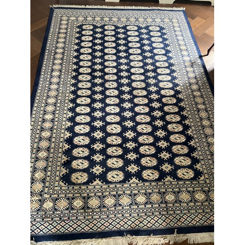 1222 - A large blue ground wool rug. 278 x 191cm.