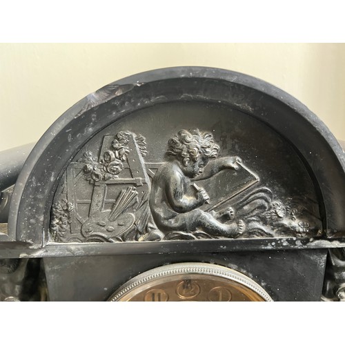 998 - A 19thC slate mantel clock with decorative panel to top and two caryatids to either side of brass di... 