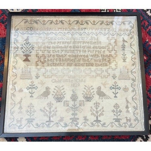 890 - A 19th century cross stitch sampler by Charlotte Child 1828.  “Diligence, industry and the proper im... 