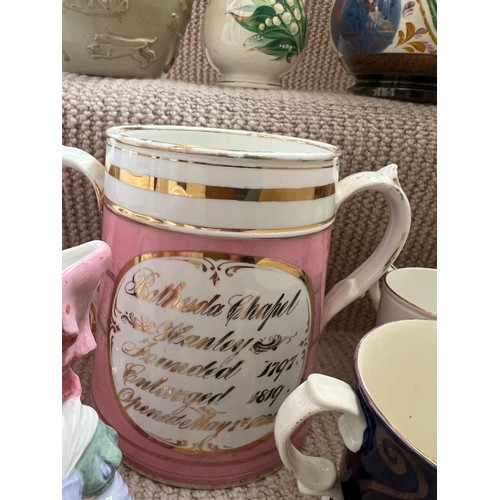 272 - A quantity of mainly 19thC mugs and jug to include a 20thC frog surprise mug, commemorative chapel m... 