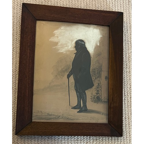 1406 - A painted silhouette of a gentleman, frame size 33cm x 26cm.