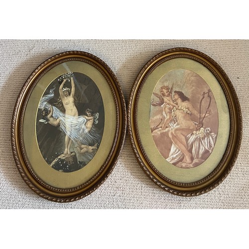 1370 - A pair of oval gilt framed prints of scantily clad females with cherubs. Print size 35cm x 25cm.