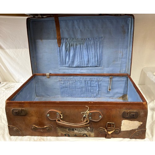 1257 - A pair of 1930's vintage suitcases with original world wide travel labels largest to measure 70cm x4... 