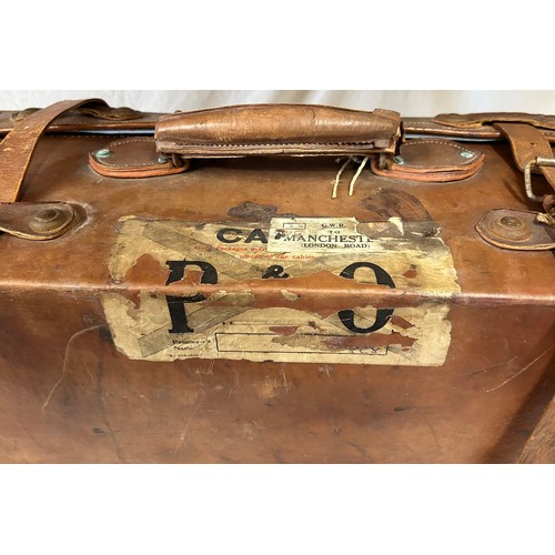 1257 - A pair of 1930's vintage suitcases with original world wide travel labels largest to measure 70cm x4... 