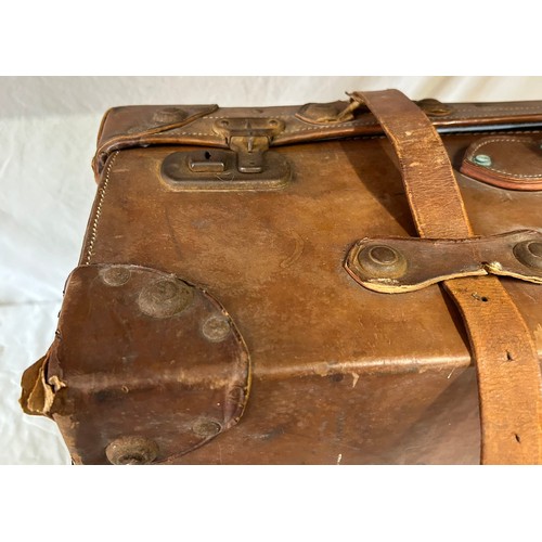 1257 - A pair of 1930's vintage suitcases with original world wide travel labels largest to measure 70cm x4... 