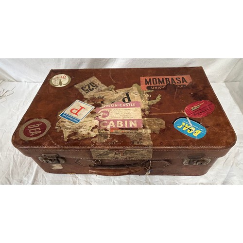 1257 - A pair of 1930's vintage suitcases with original world wide travel labels largest to measure 70cm x4... 