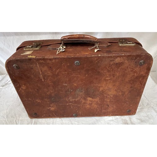 1257 - A pair of 1930's vintage suitcases with original world wide travel labels largest to measure 70cm x4... 