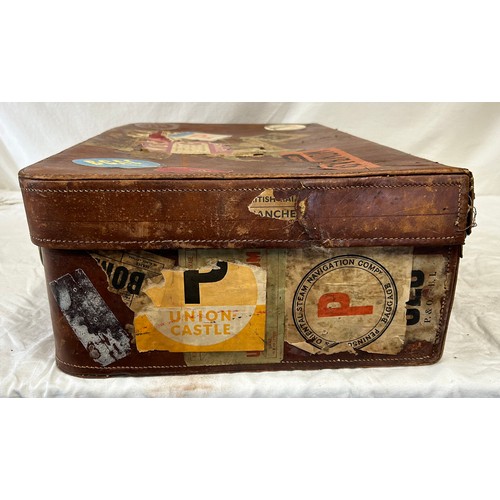 1257 - A pair of 1930's vintage suitcases with original world wide travel labels largest to measure 70cm x4... 