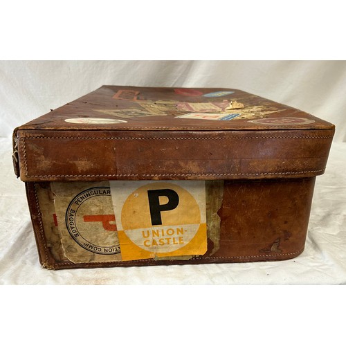 1257 - A pair of 1930's vintage suitcases with original world wide travel labels largest to measure 70cm x4... 