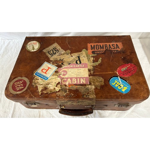 1257 - A pair of 1930's vintage suitcases with original world wide travel labels largest to measure 70cm x4... 