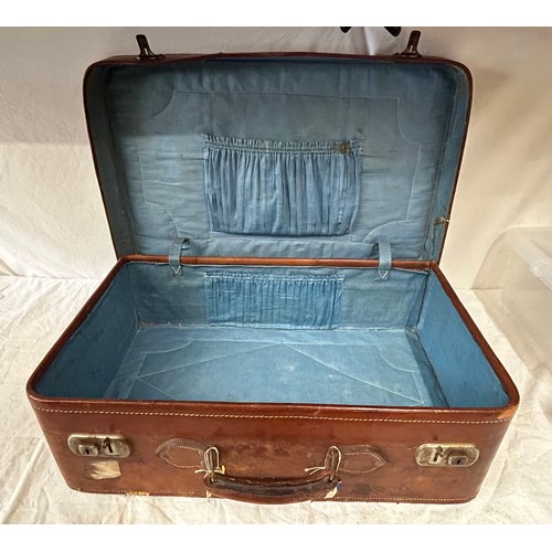 1257 - A pair of 1930's vintage suitcases with original world wide travel labels largest to measure 70cm x4... 