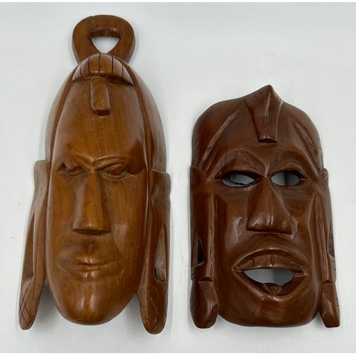 929 - A collection of six hand carved wooden wall plaques along with two tribal wooden hand carved wooden ... 