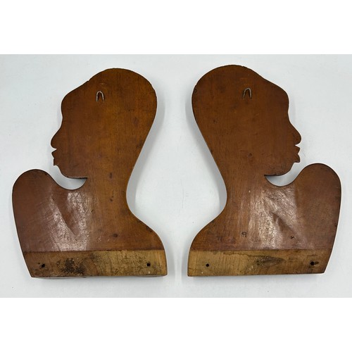 929 - A collection of six hand carved wooden wall plaques along with two tribal wooden hand carved wooden ... 