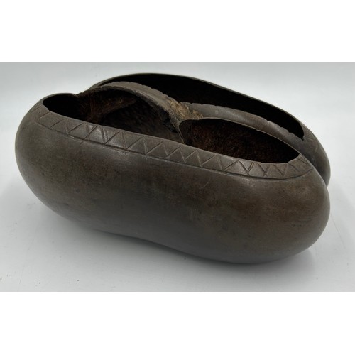 930 - A traditional Coco De Mer trug measures approx. 20cm wide.