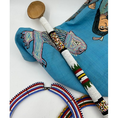 931 - Traditional African tribal pieces to include Maasai beaded necklaces, a beaded dance stick, water ca... 