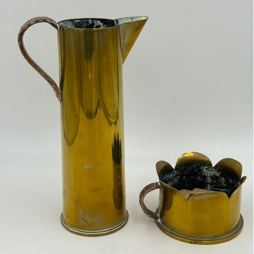 967 - Trench art to include a jug marked 1916 and a small planter marked 1918. Jug measures 30cm high.