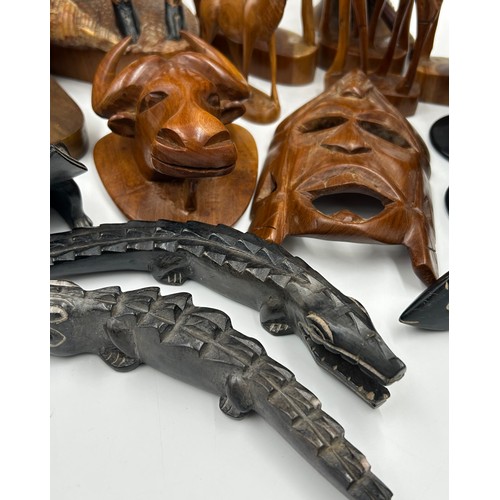 928 - A Collection of African carvings and animals to include Giraffe 53cm h, 5 x animals, 4 x wall plaque... 