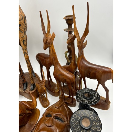 928 - A Collection of African carvings and animals to include Giraffe 53cm h, 5 x animals, 4 x wall plaque... 