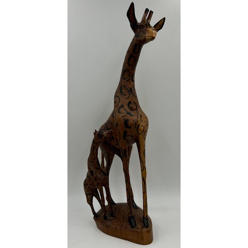 928 - A Collection of African carvings and animals to include Giraffe 53cm h, 5 x animals, 4 x wall plaque... 