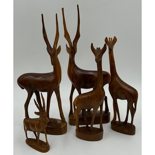 928 - A Collection of African carvings and animals to include Giraffe 53cm h, 5 x animals, 4 x wall plaque... 