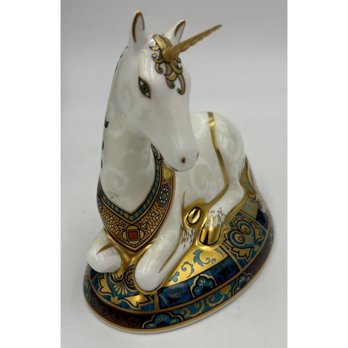 359 - A boxed Royal Crown Derby limited edition Unicorn paperweight, 364/2000 14cm h. Multiple signatures ... 