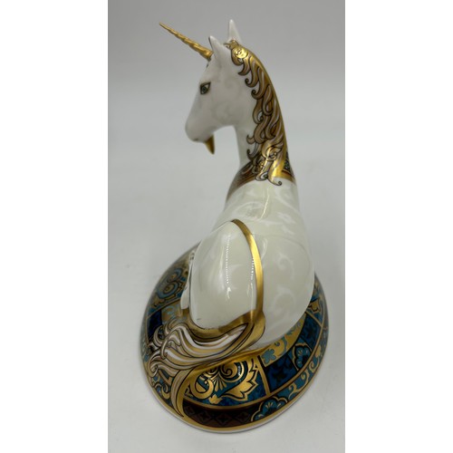 359 - A boxed Royal Crown Derby limited edition Unicorn paperweight, 364/2000 14cm h. Multiple signatures ... 