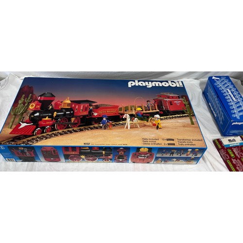 1074 - A large collection of Playmobil to include 4032 Pacific Railroad large scale trainset, appears compl... 