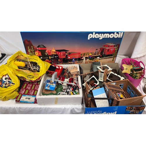 1074 - A large collection of Playmobil to include 4032 Pacific Railroad large scale trainset, appears compl... 