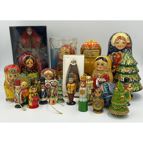 365 - A collection of 20thC Russian and USSR  wooden Matryoshka graduating nests of dolls and other folk a... 